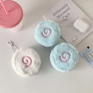 Close-up of soft plush Narutomaki coin purse with pink spiral embroidery and metal hook
