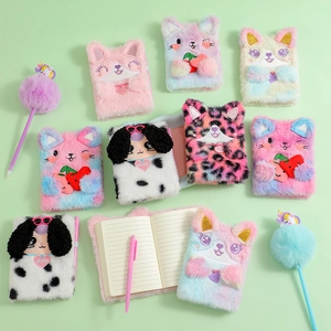 Detail of plush cat and dog notebooks with matching unicorn pens and soft faux fur covers