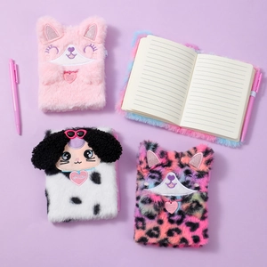 Detail of plush animal notebooks showing furry texture, embroidered faces, and lined paper