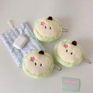 Detailed close-up of three plush apple-shaped coin purses with embroidery and chain