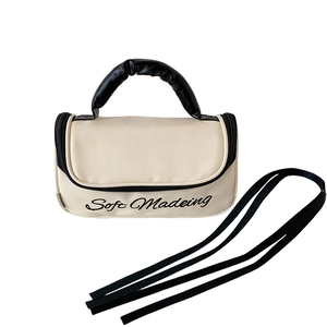 Cute off-white ballet style large capacity makeup bag with black handles and strap