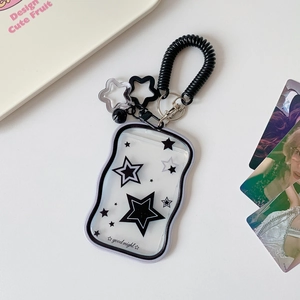 Close-up of wavy clear star card holder with black spring lanyard and cute charms