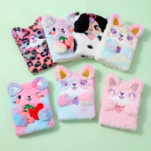Close-up of soft plush notebook covers with cartoon animal shapes and embroidery details