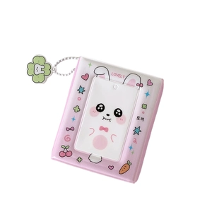 Pink rabbit photocard holder album with lucky clover charm and transparent display window
