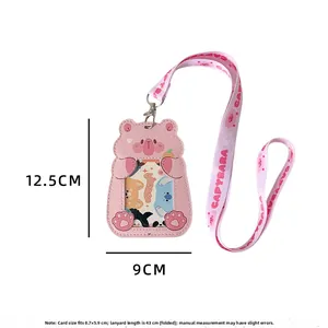 Detailed view of pink capybara ID card holder with matching long neck lanyard