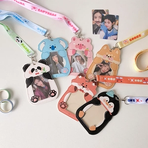 Detailed close-up of cartoon PU card holders with animal embroidery and matching lanyards