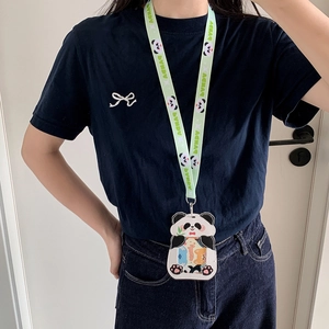 Detail of cute panda cartoon card holder with printed lanyard and metal hook