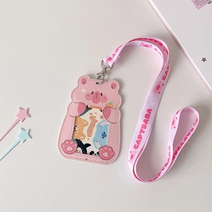 Detailed view of pink cartoon Capybara card holder with matching lanyard and PU leather texture