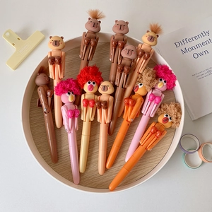 Close-up of cute cartoon boxing pens with capybara and bird figures on a tray