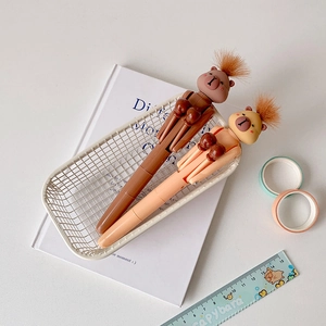 Detail of Capybara boxing pens in a storage basket featuring plush hair and creative design