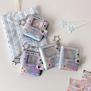 Macro detail of iridescent laser mini photo album with retro player design and star clasp