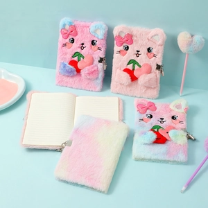 Detailed view of the cat plush notebook set with metal lock and heart-topped pen
