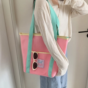 Bolso de malla rosa con asas verde menta y bolsillo frontal para playa y compras