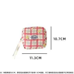 Detail view of pink plaid makeup bag showing 11.3cm width and 10.7cm height dimensions