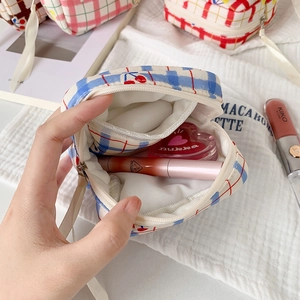 Mini cherry plaid fabric pouch showing internal storage for cosmetics and makeup