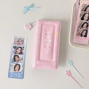 Detailed view of a pink bow mini photo card album with a transparent cover display slot