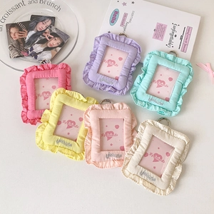 Flat lay of colorful plush photocard sleeves with elegant ruffled edges and itsocute embroidery