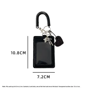 Detail view of black PU card holder showing 10.8x7.2cm dimensions and heart charm