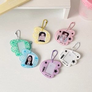 Candy-colored wing-shaped acrylic photo frame keychains in six vibrant glitter colors