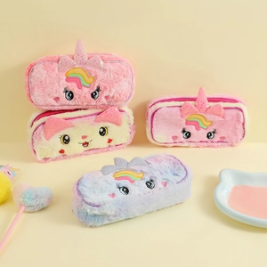 Detail of plush unicorn pencil cases with 3D ears and colorful embroidery