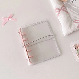 Transparent PVC binder with pink three-ring binder mechanism and elastic strap closure