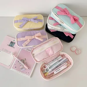 Large capacity bow pencil case in pastel colors featuring a spacious interior organizer