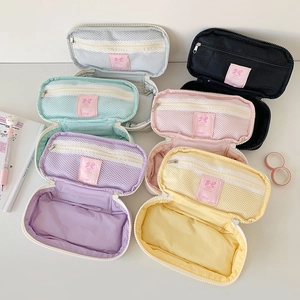 Pastel ballet-style pencil cases with bow detail and mesh organizers in multiple colors