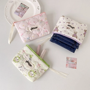 Quilted cotton pouch set with floral and bear prints for cosmetics and personal items