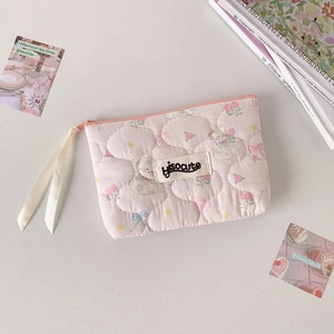 Detailed view of pink quilted storage bag with cute bear and floral patterns and silk zipper