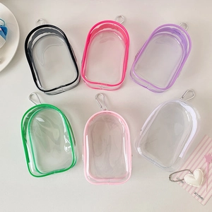 Set of six colorful transparent PVC mini pouches with zippers and metal hooks for dolls