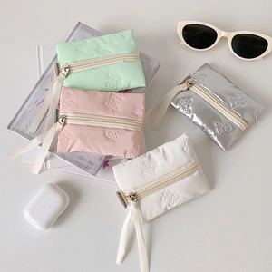 Quilted mini bow organizers in pastel colors for coins, lipsticks and cables
