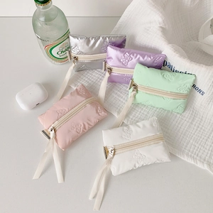 Five assorted pastel bow-quilted mini storage bags for earphones and lipsticks