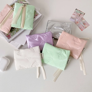 Quilted mini bow coin pouches in pastel colors for earphones and cards storage