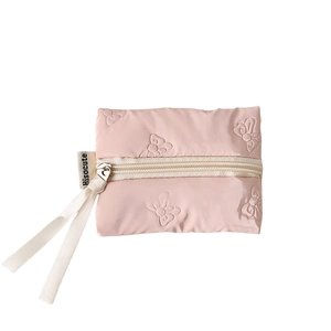 Pink quilted bow-textured mini coin purse with stylish silk ribbon zipper pull