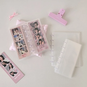 Macro view of clear frosted PP mushroom hole loose-leaf binder for photocard storage