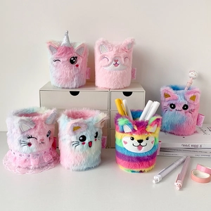 Detailed view of colorful plush animal pen holders with cute embroidery on a desk