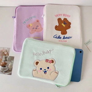 Detailed plush laptop sleeve with cute bear embroidery and smooth zipper closure