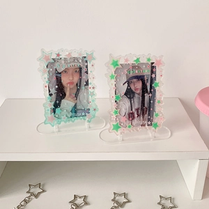 Detail of clear acrylic idol card holders with star patterns and wave edges