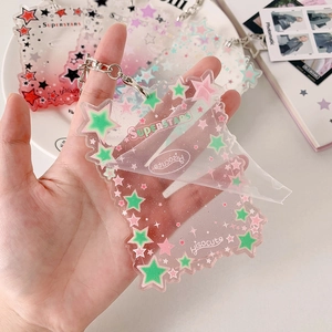 Detailed close-up showing protective film removal from transparent star acrylic card holder
