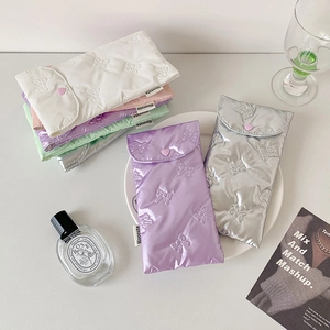 Pastel bow quilted stationery pouches in various colors with heart snap button closure