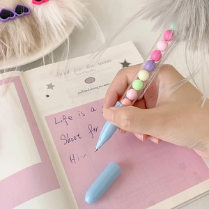 Cute cartoon pom pom ballpoint pen with colorful beads and light blue barrel