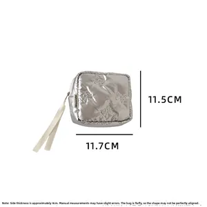 Silver bow-quilted square cosmetic pouch with ribbon strap, size 11.7cm x 11.5cm x 4cm