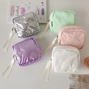 Square bow-embossed makeup pouches in five pastel colors with long ribbon zippers