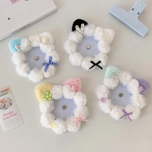 Detail of plush 58mm badge holders with cute cat ears in various macaron colors
