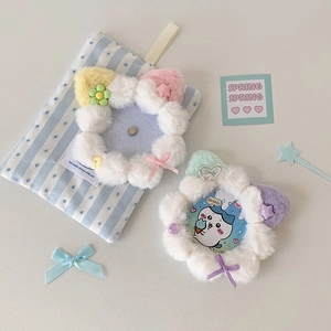 Detail of plush flower badge holders with cute pastel star and ribbon decorations