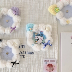 Detail of colorful plush cat ear badges with lace bows and cute decorative stars