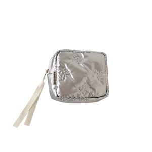 Square silver quilted makeup bag with bow pattern and satin ribbon zipper pull