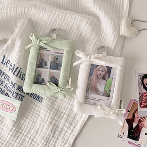Plush bow photocard holders in mint and cream with metallic keyrings for bag decor