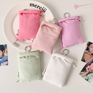 Macro detail of multi-color puffy card holders with metal rings and Hisocute labels