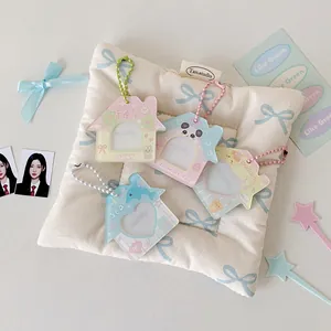 Close-up of pastel house-shaped acrylic card holders with colorful bead chains